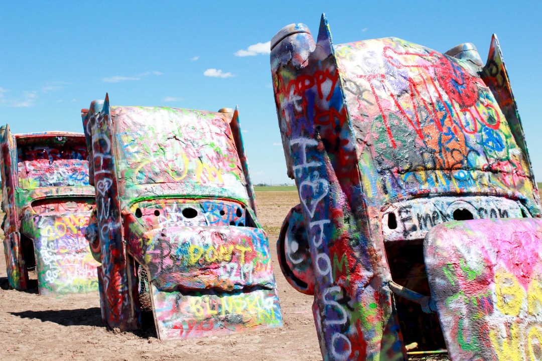 spray painted cadillacs stood on end at Caddilac Ranch
