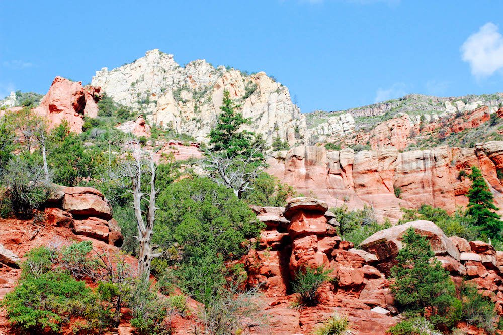 red rock cliffs and a sandstone mountain