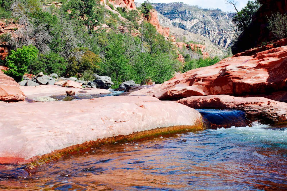 a river running through the sedona rock slide