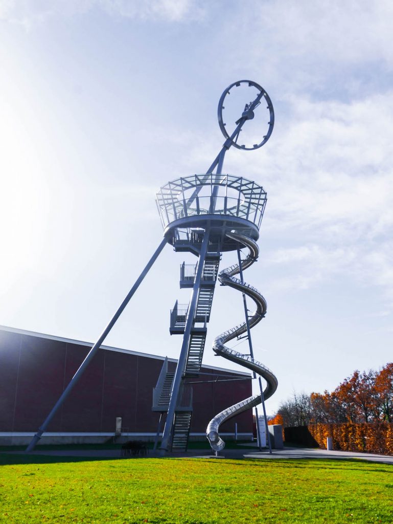 A giant rotating clock tower that doubles as a slide at the Vitra Museum, Germany