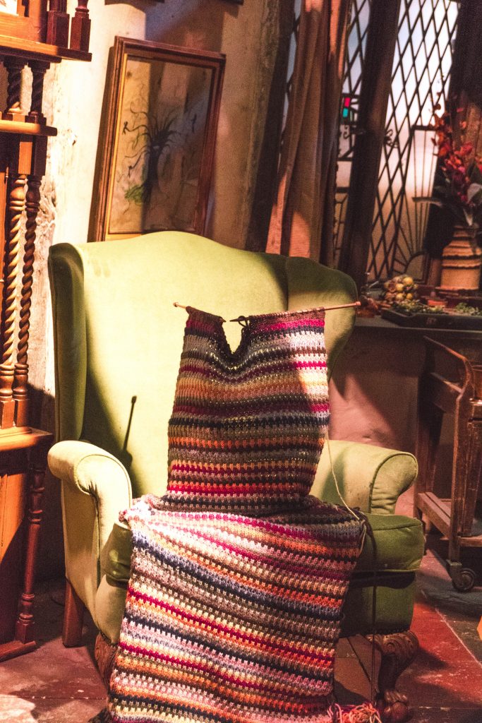 Mrs. Weasley's chair and knitting in the Burron, Warner Bros Harry Potter Studio Tour London