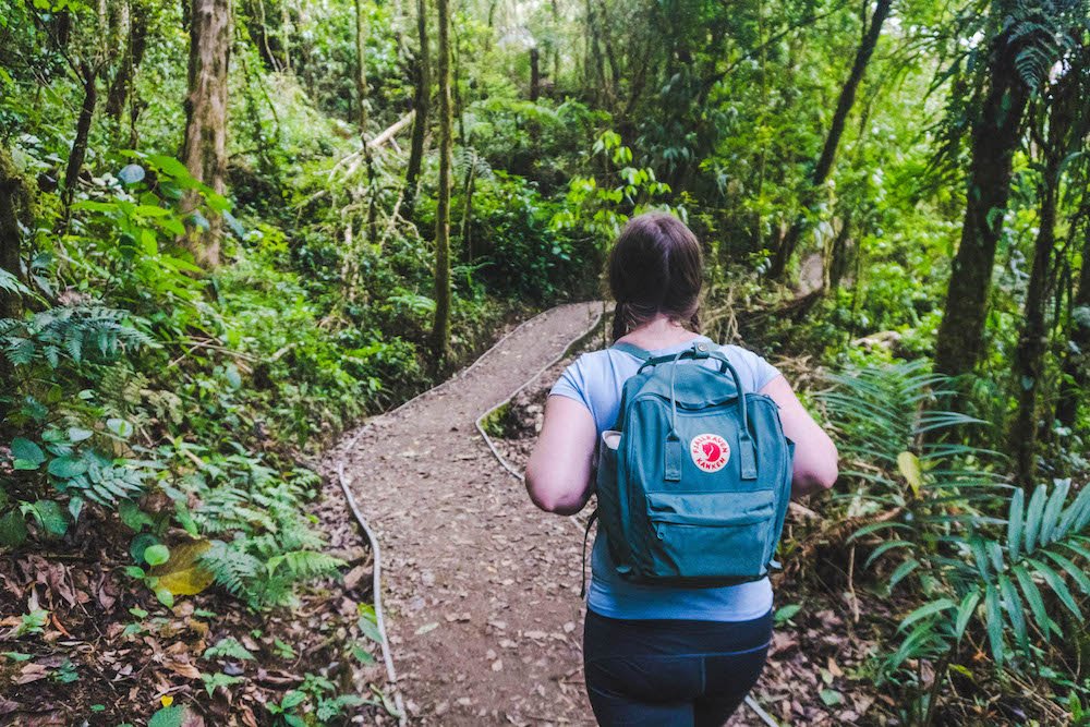 Addie hiking with her backpack