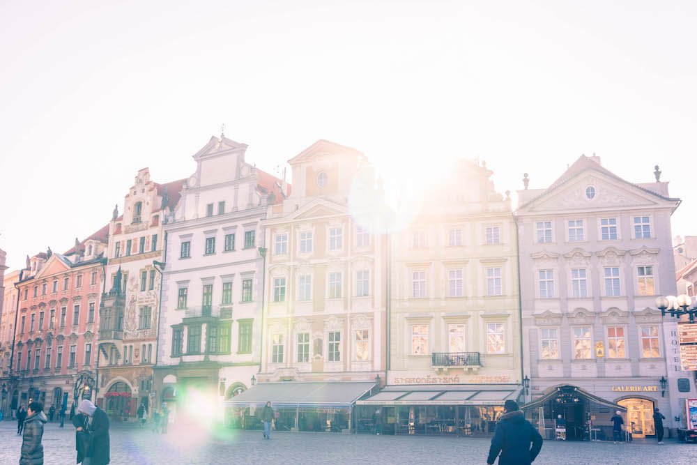 Light shining through the clouds on the Old Town Square in Prague