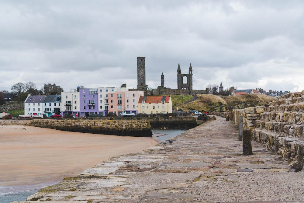 looking down the pier towards east sands and the cathedral in St. Andrews, Scotland