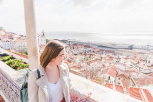 Addie staring out across Lisbon from a viewpoint