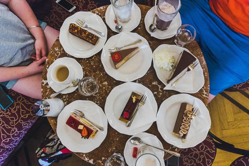 6 slices of cake on one table in Cafe Central in Vienna, Austria