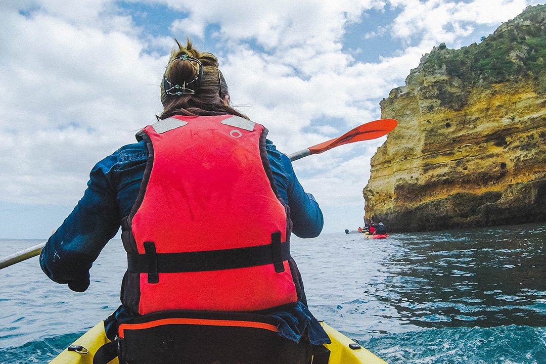 Madison paddling on our Kayak Tour in Lagos, Portugal -- on of the coolest things to do in Lagos Portugal