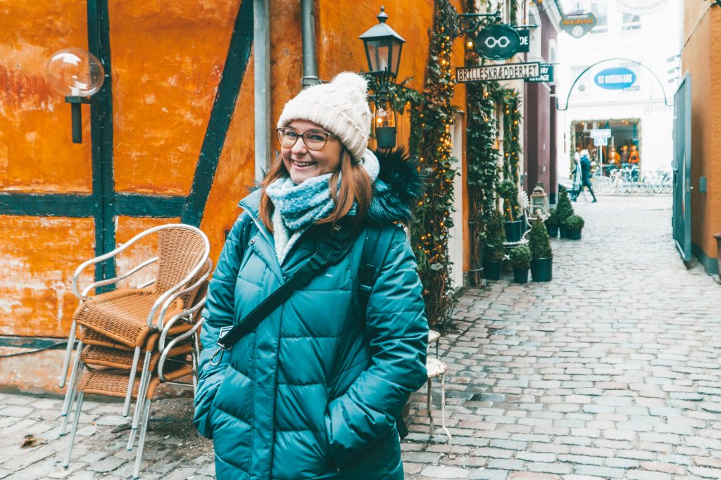 Addie smiling while all bundled up in Copenhagen