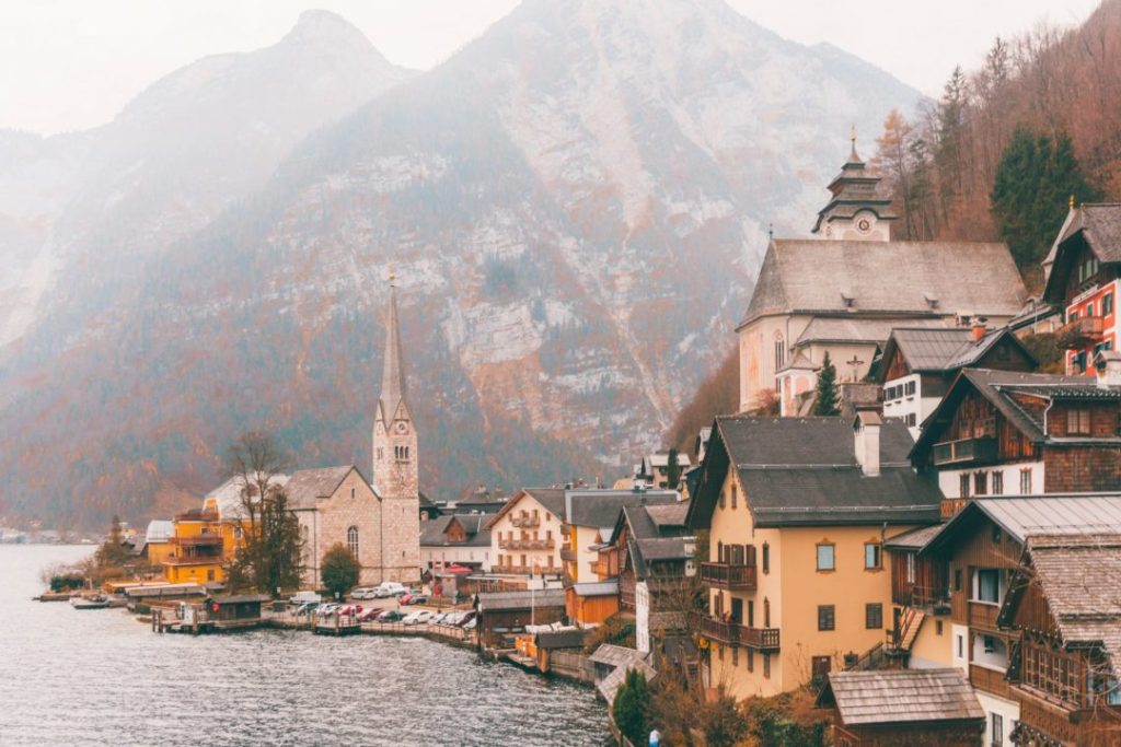 The classic view of Hallstatt: village buildings piled on top of each other and the church at the far edge of the land curving out into the water