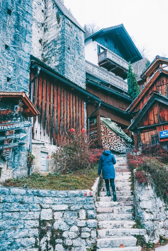 Addie walking up stone steps in Hallstatt, Austria. Taken with a tripod, another great way to take pictures of yourself
