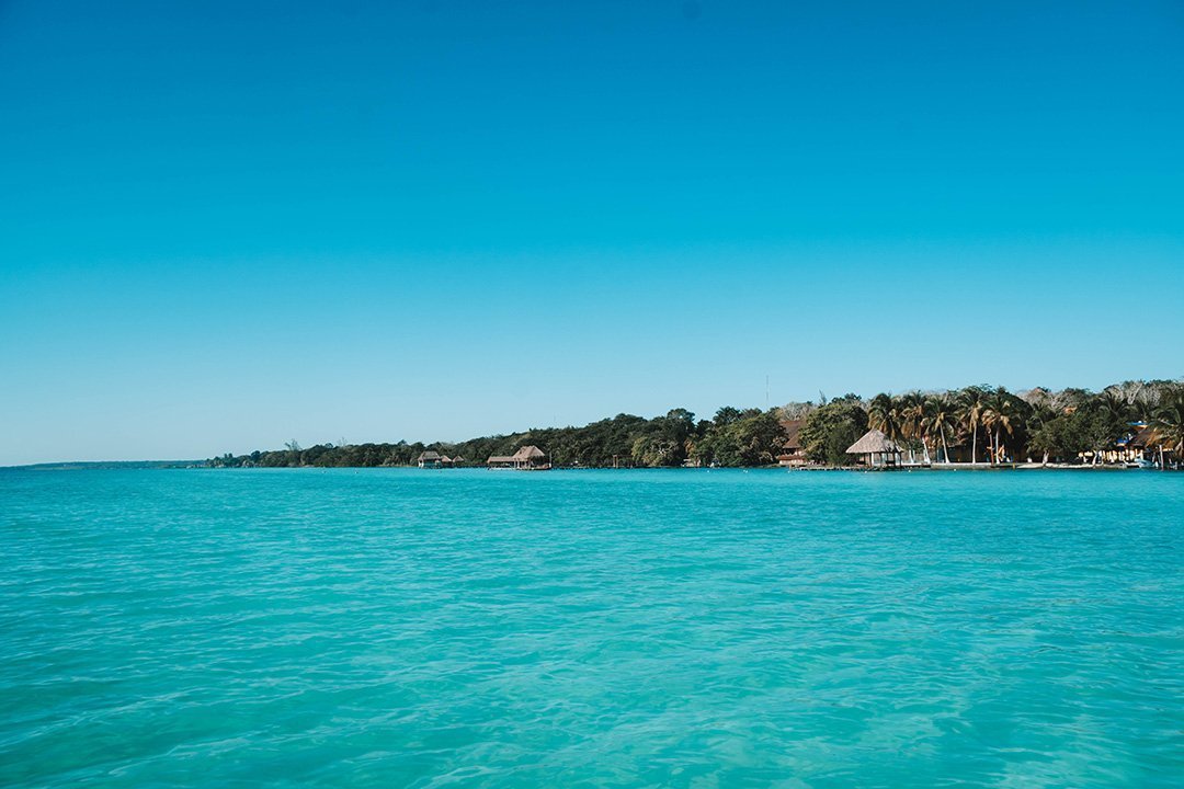 The shoreline of Bacalar, Mexico as seen from the lagoon