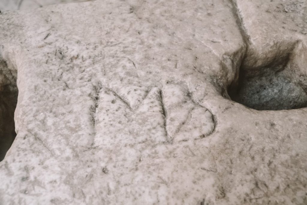 Michelangelo's initials carved into a random stone. Find this on a Vatican guided tour!