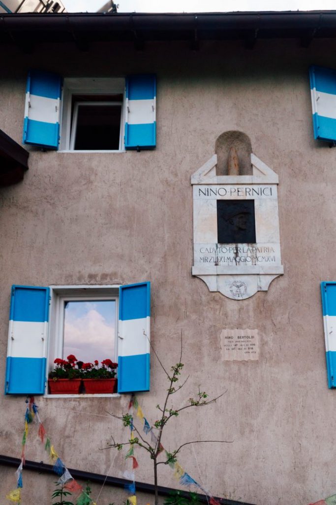 Blue at white shutters of Rifugio Nino Pernici in Valle di Ledro, Italy