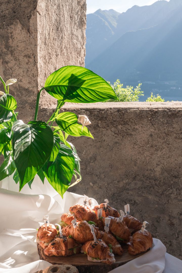 Food and a lit up plant from a window in the back