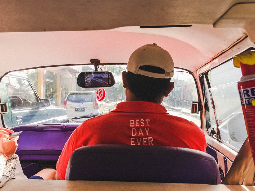 The driver of the VW Kombi wearing an Urban Adventures Best. Day. Ever. polo on our safari of Seminyak spas