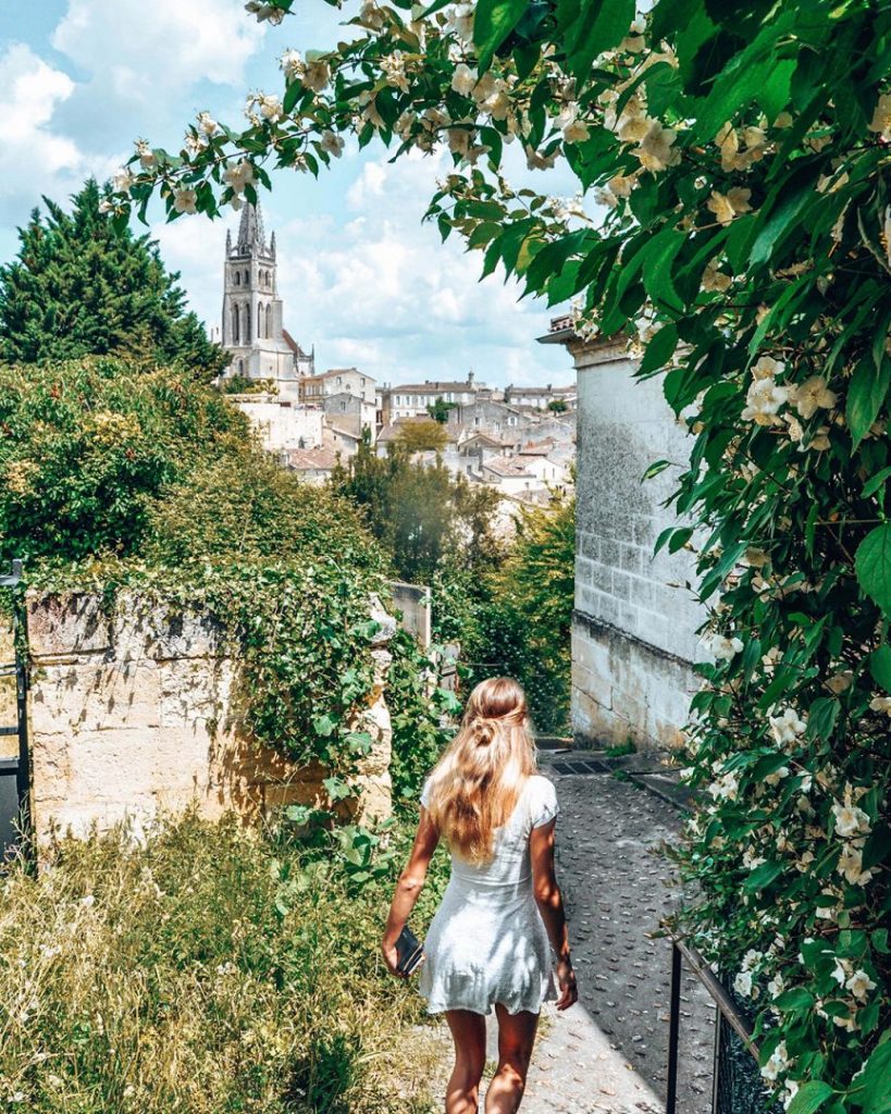 A girl going down hidden steps in Exeter, England