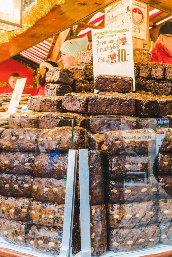 many loaves of fruchtebrot stacked up in a display