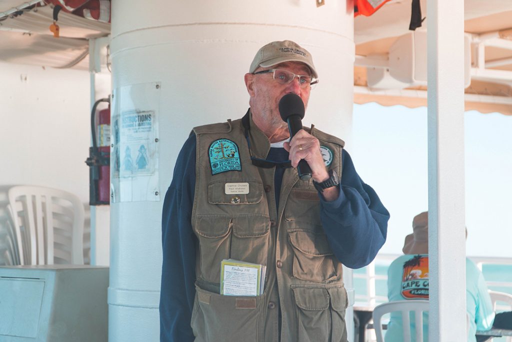 a JN Ding Darling guide giving commentary on the Captiva dolphin cruise
