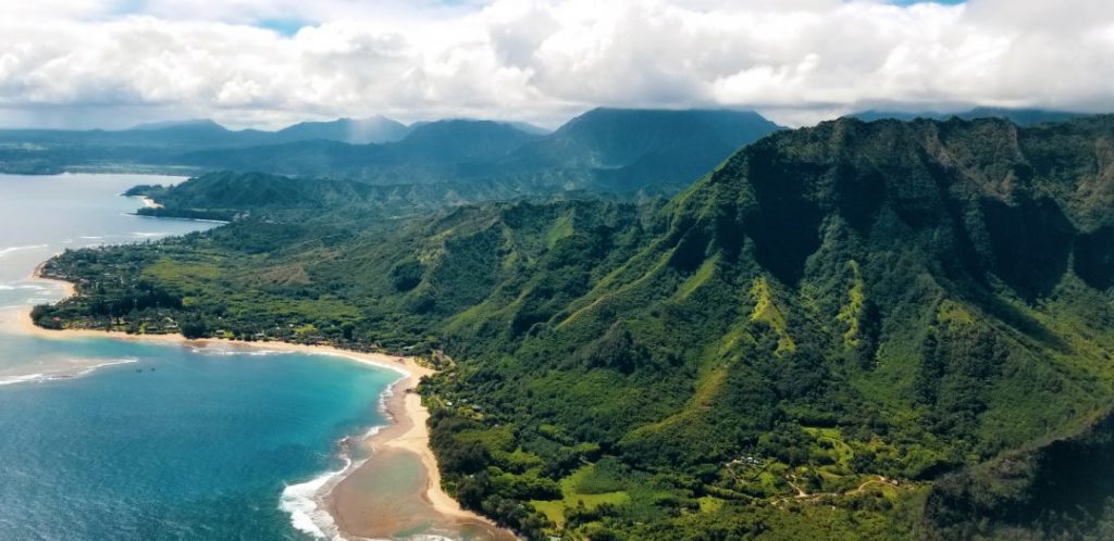a green mountainous coastline in Hawaii