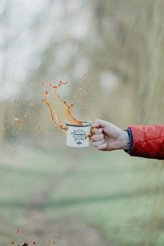 coffee splashing out of a mug, frozen in mid air with a long shutter speed exposure