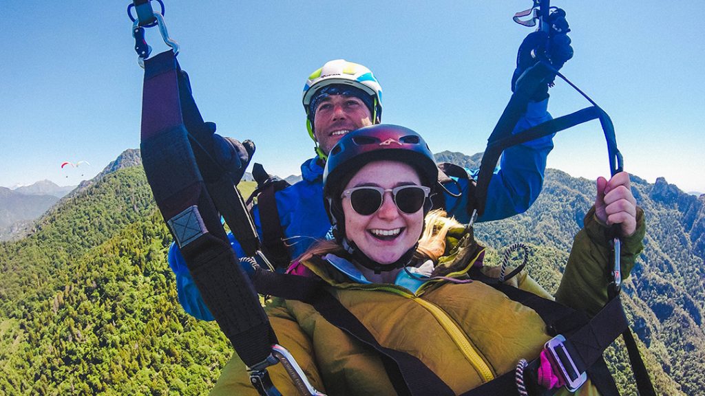 addie and her tandem paragliding pilot