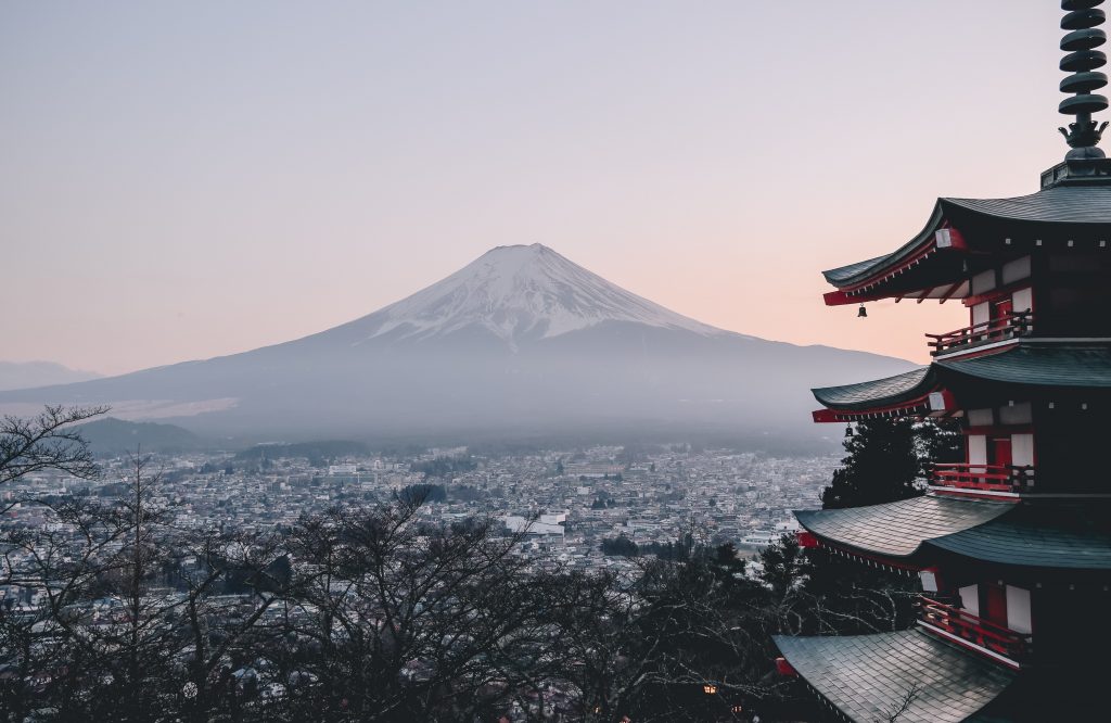 a pagoda in front of mount fuji, japan