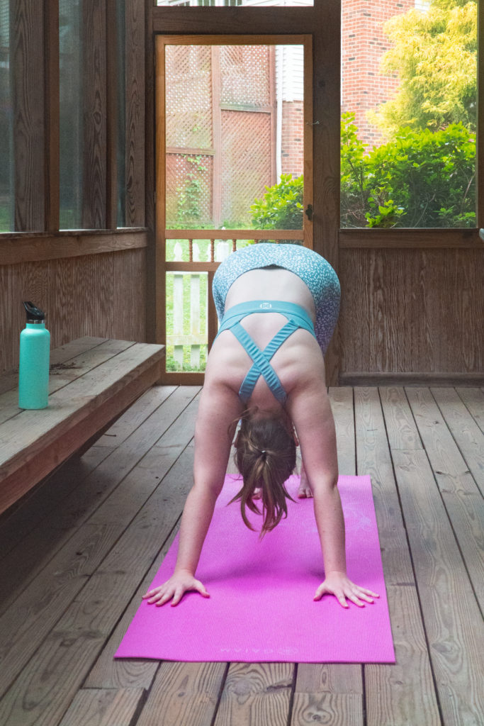 doing yoga on a screened-in porch