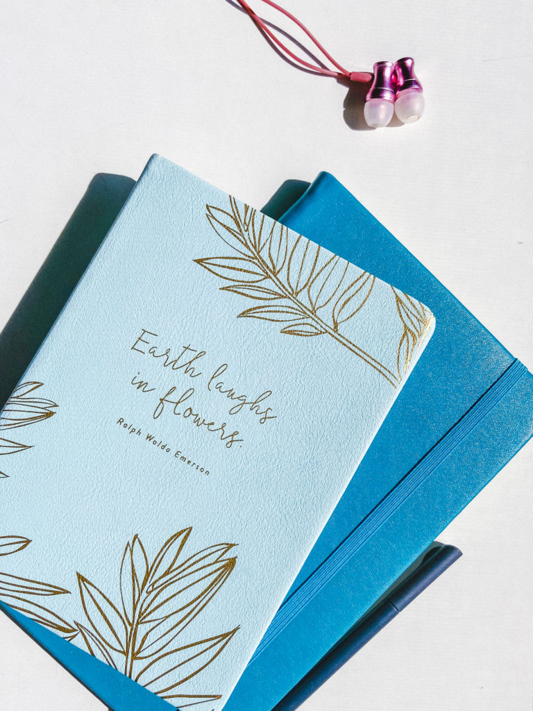 two blue journals stacked on top of each other
