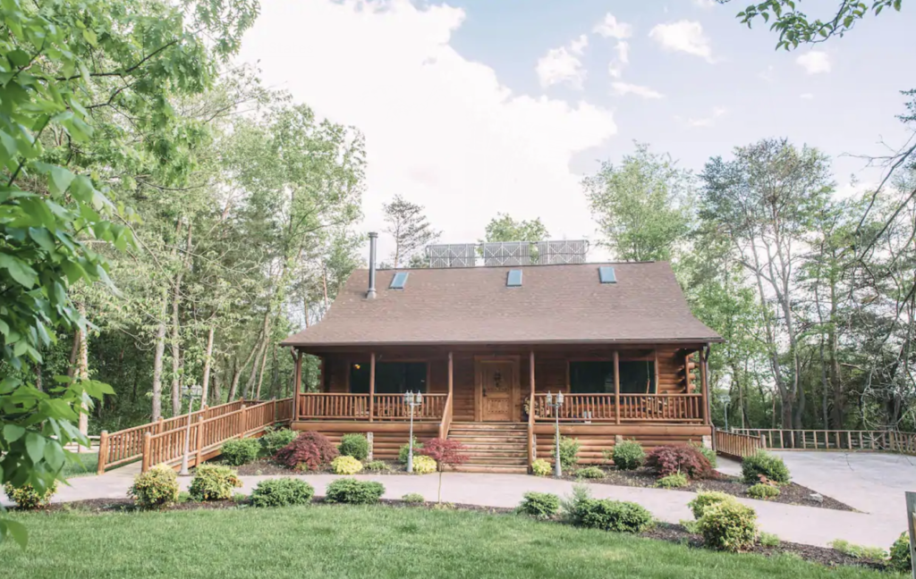 a log cabin with solar panels on the roof