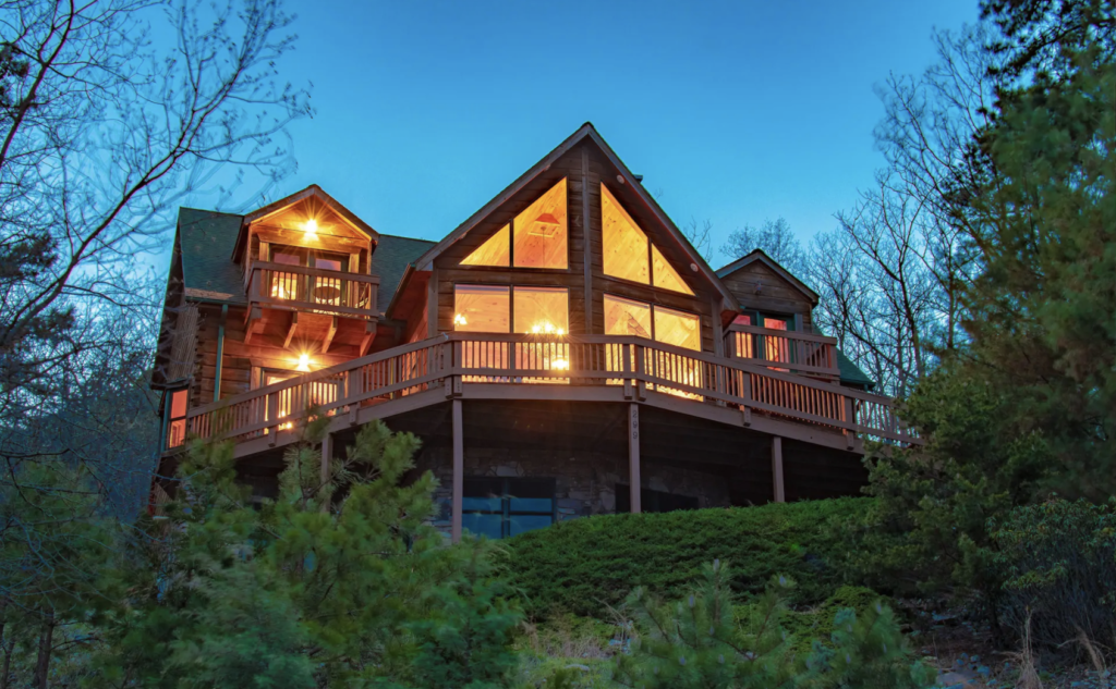a large wood cabin with floor-to-ceiling windows - shenandoah national park cabins