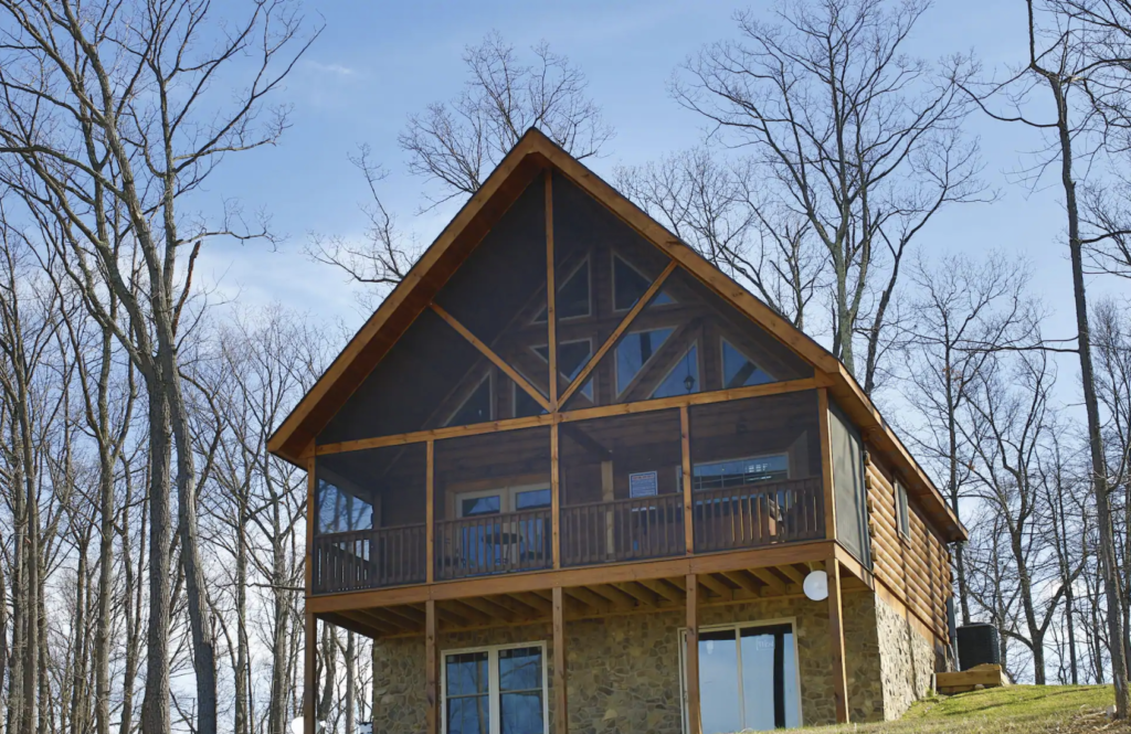 a shenandoah national park cabin with traingle roof and lots of windows